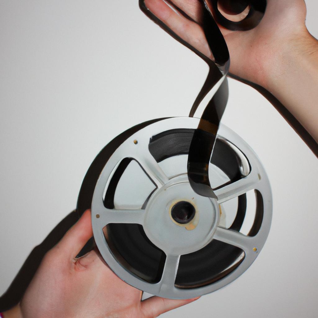 Person holding a film reel